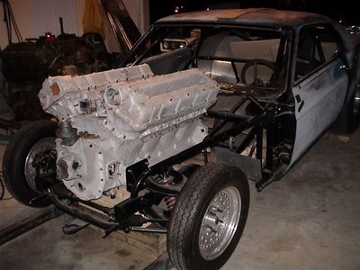 1974 Ford F-100 - This custom drag car features a massive V-engine mounted in its chassis, with the front end visible.