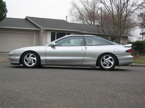 1994 Ford Probe - This silver 1994 Ford Probe GT is parked on a residential street.