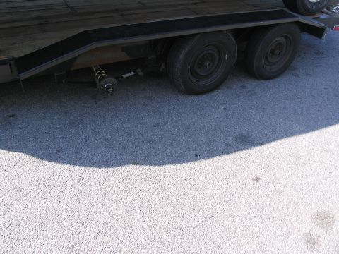 1995 Ford C-350 (Centurion Conversions) - Trailer axle repair needed, one wheel is missing from the axle assembly.