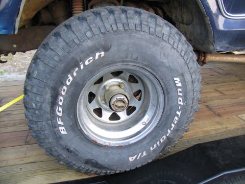 1978 Ford Bronco - Close-up of a BFGoodrich Mud-Terrain T/A tire mounted on a blue vehicle.