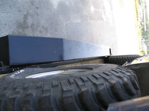 1978 Ford Bronco - Two spare tires are visible in the bed of a truck, one is a BFGoodrich All-Terrain T/A.