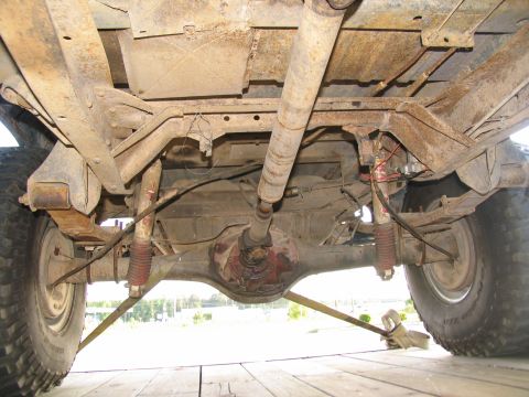 1978 Ford Bronco - Underside view of a vehicle, showing suspension components and drivetrain.