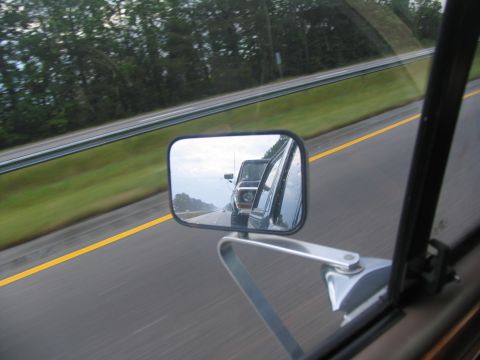 1978 Ford Bronco - Driving on the highway with a 1978 Ford Bronco visible in the side mirror.