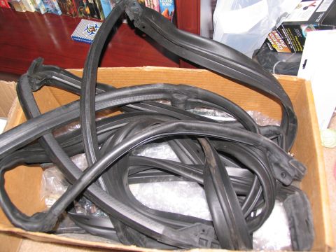 1995 Ford C-350 (Centurion Conversions) - A collection of rubber seals is piled inside a cardboard box.