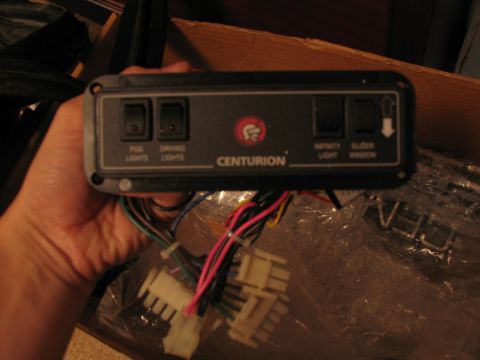 1995 Ford C-350 (Centurion Conversions) - This Centurion control panel features switches for various vehicle functions, including lights and a slider window.