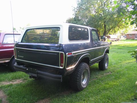 1995 Ford C-350 (Centurion Conversions) - Rear view of a 1978 Ford Bronco, parked outdoors on a sunny day.