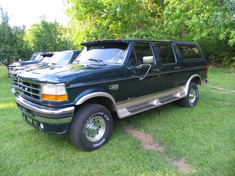1995 Ford C-350 (Centurion Conversions) - 1995 Ford C-350 Centurion Conversion van, a modified Ford truck with extended body, parked outdoors.