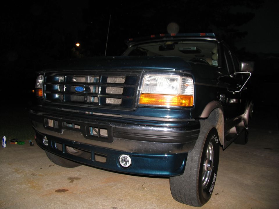 Dark teal 1995 Ford C-350 (Centurion Conversions) front view