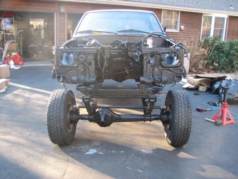 1994 Toyota Tacoma - This truck chassis is undergoing repairs or modifications, with its front end completely disassembled.