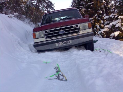1989 Ford Bronco - This 1989 Ford Bronco is stuck in the snow on a wooded hill.