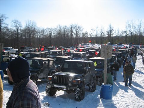 2002 Jeep Wrangler - A group of Jeep Wranglers are parked in a snowy area, ready for off-road adventure.