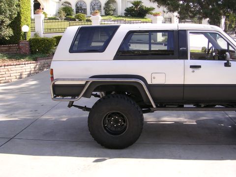 1985 Toyota 4Runner - This 1985 Toyota 4Runner features a two-tone paint scheme and prominent side protection bars.