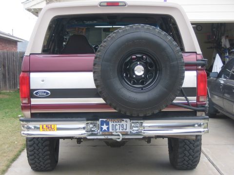 1996 Ford Bronco - This Ford Bronco features a spare tire on the rear, a common accessory for off-road vehicles.