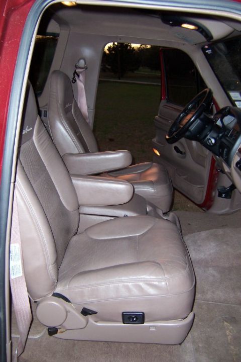 1996 Ford Bronco - Interior view of a 1996 Ford Bronco, highlighting the tan leather captain's chairs and dashboard.