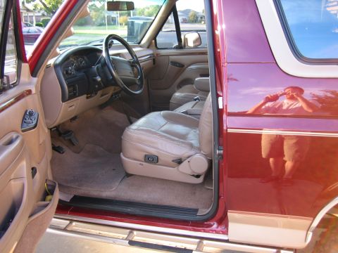 1996 Ford Bronco - Interior view of a 1996 Ford Bronco, tan leather seats and dashboard details.