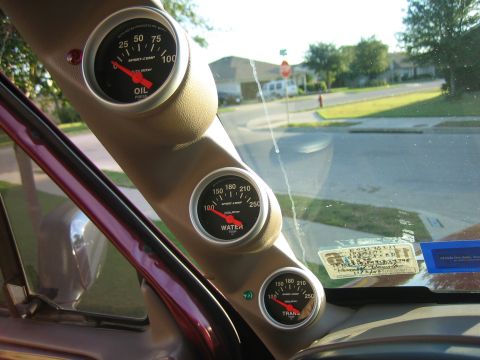 1996 Ford Bronco - Interior view of dashboard gauges including oil pressure, water temp, and transmission temp.