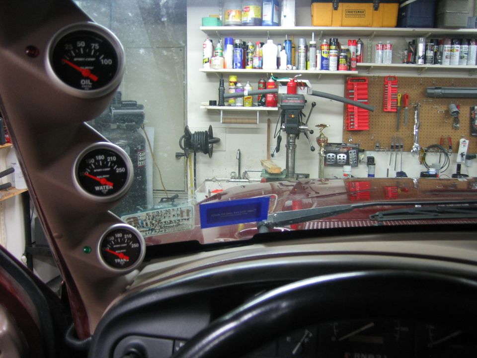 A-pillar pod with three Auto Meter Sport-Comp gauges: oil, water and trans temp