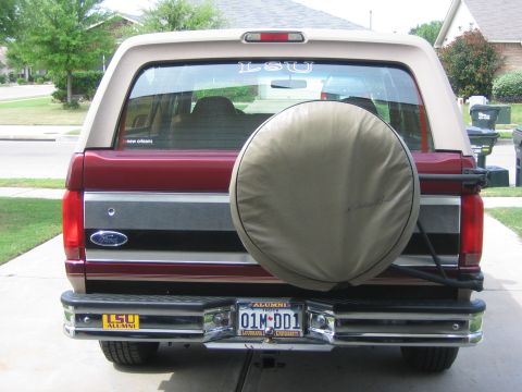 1996 Ford Bronco - This 1996 Ford Bronco features a spare tire mounted on the rear, along with LSU alumni decals.