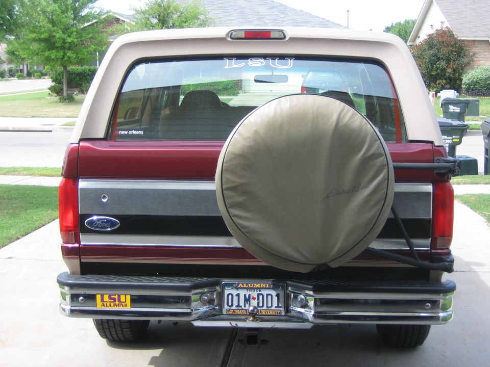 Rear of a 1996 Ford Bronco with a spare tire cover and LSU decals