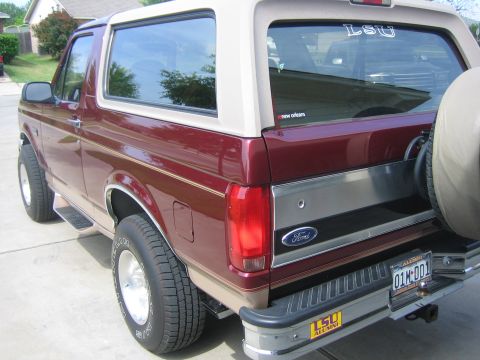 1996 Ford Bronco - This Ford Bronco has a two-tone paint job and a spare tire mounted on the rear.