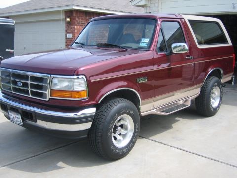 1996 Ford Bronco - This maroon Ford Bronco features tan lower body trim and chrome accents.