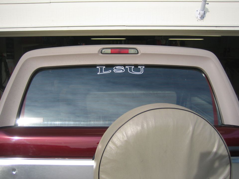 Rear view of a 1996 Ford Bronco with an LSU sticker on the back window
