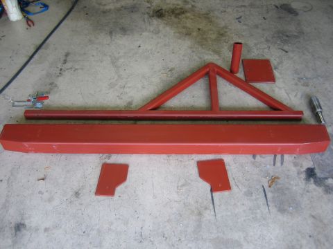 1996 Ford Bronco - Custom bumper and frame components are arranged on a workshop floor.
