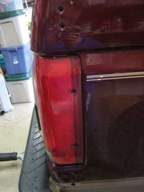 1996 Ford Bronco - Rear tail light assembly with visible mounting holes.