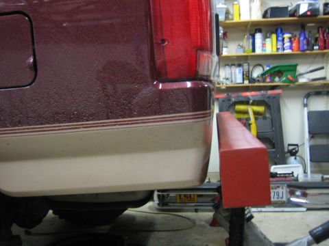 1996 Ford Bronco - Close-up of the rear bumper and tail light assembly on a 1996 Ford Bronco.