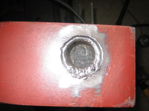 1996 Ford Bronco - A close-up view of a welded metal component, showing the texture of the weld and surrounding material.