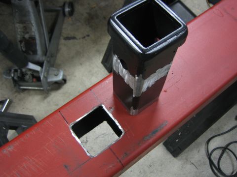 1996 Ford Bronco - Close-up of a custom receiver hitch fabrication, showing a welded square tube and a cut opening.