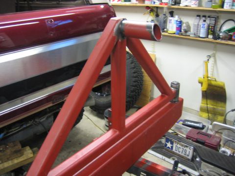 1996 Ford Bronco - A custom-built swing-away tire carrier is shown attached to a vehicle's rear, with a spare tire mounted behind it.