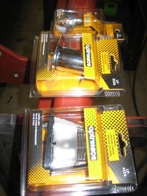 1996 Ford Bronco - Two packages of Optronics automotive lights are displayed, each containing a different model.