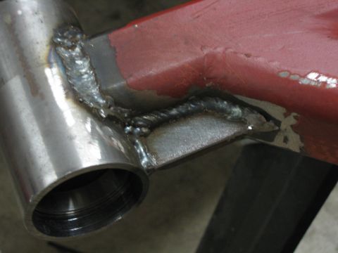 1996 Ford Bronco - Close-up of a metal part with visible welds and a red painted section.