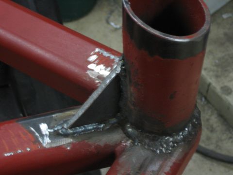 1996 Ford Bronco - Welded joints on a red metal frame, likely a custom bumper build.