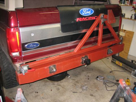 1996 Ford Bronco - Custom rear bumper and spare tire carrier installed on a red Ford Bronco.