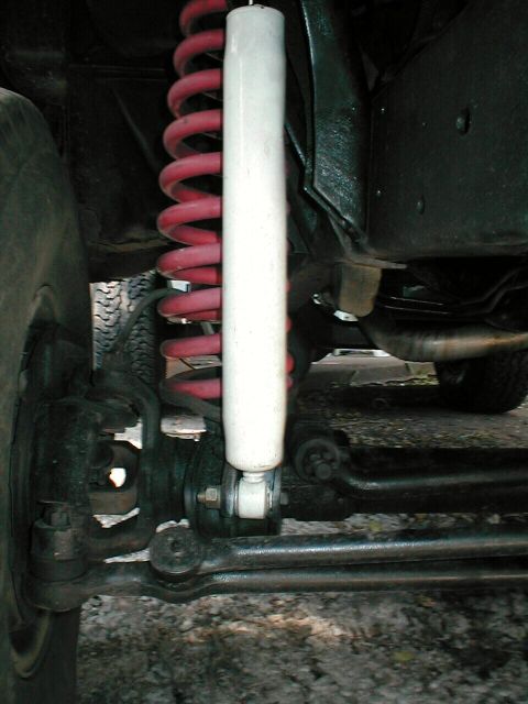 1979 Ford Bronco - here you see that the lower shock mounts to the inner side of the mounting "ear" or "horn" that sticks out