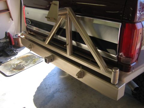 1996 Ford Bronco - Custom rear bumper and spare tire carrier installed on a vehicle.