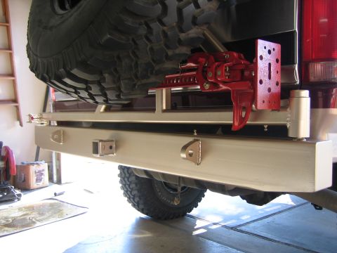 1996 Ford Bronco - Custom rear bumper assembly on a 1996 Ford Bronco, including a spare tire mount and hi-lift jack.