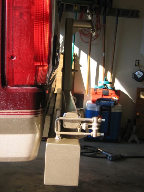 1996 Ford Bronco - Rear view of a 1996 Ford Bronco showing its bumper and a trailer hitch mechanism.