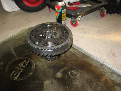 1996 Ford Bronco - A differential gear assembly sits in a Blitz oil pan, ready for installation.