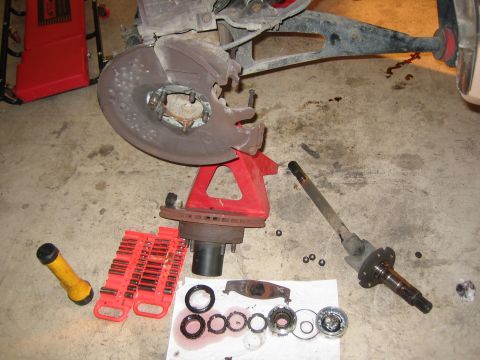 1996 Ford Bronco - Vehicle axle and brake components disassembled for repair or maintenance.