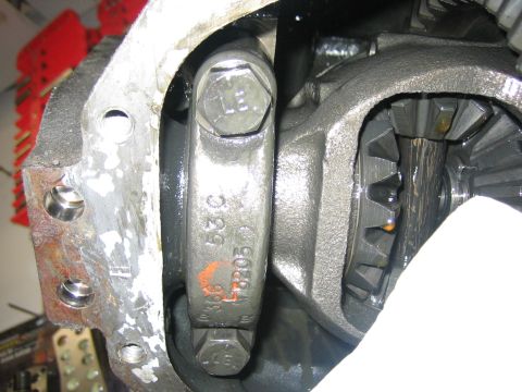 1996 Ford Bronco - Differential gears and housing with part numbers visible on a bolt.