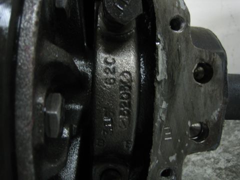 1996 Ford Bronco - This image shows a close-up of a cast metal automotive part, possibly from a differential, with visible casting numbers.