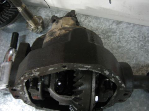 1996 Ford Bronco - Close-up of a vehicle's differential housing and internal gears, with a driveshaft yoke visible.