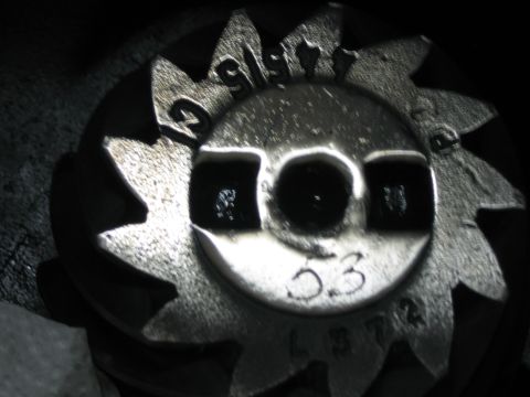1996 Ford Bronco - Close-up of a differential gear showing stamped manufacturing codes, including '9177' and '53'.