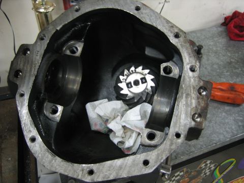 1996 Ford Bronco - Close-up view of a differential housing, showing internal gears and components, with paper towels placed inside.