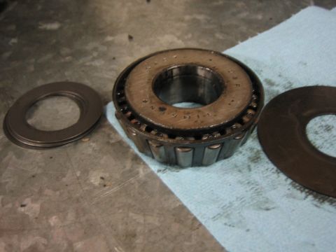 1996 Ford Bronco - Tapered roller bearing and shims, likely for a differential or hub assembly.