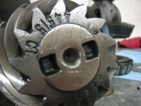 1996 Ford Bronco - Differential gear set with visible stamped markings, likely part of a locker install.