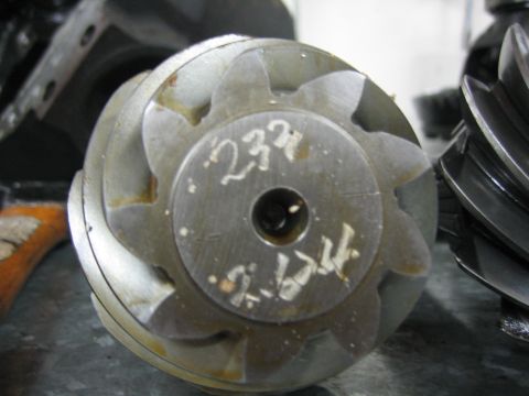1996 Ford Bronco - A differential gear set is shown with identifying numbers written on its surface.